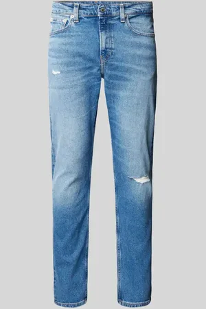 Calvin Klein Jeansy o kroju slim tapered fit z przetarciami