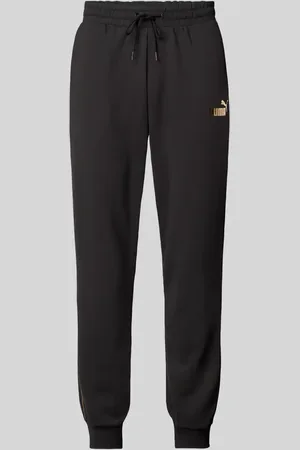 PUMA Spodnie dresowe o kroju relaxed fit z nadrukiem z logo