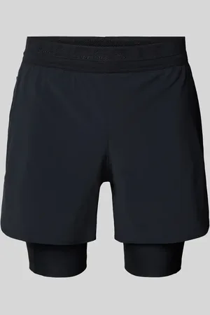 Under Armour Szorty o kroju regular fit z nadrukiem z logo