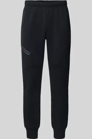 Under Armour Spodnie dresowe z nadrukiem z logo