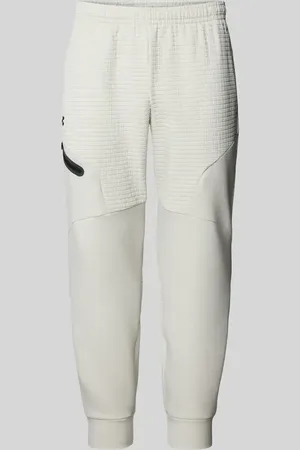 Under Armour Spodnie dresowe o kroju relaxed fit z kieszenią zapinaną na zamek błyskawiczny