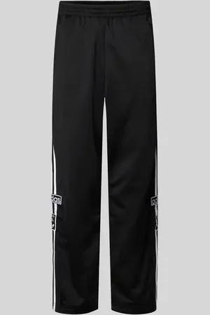 adidas Spodnie dresowe o kroju baggy fit z naszywką z logo model ‘ADIBREAK’