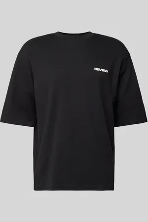 Review T-shirt o kroju oversized z nadrukiem z logo