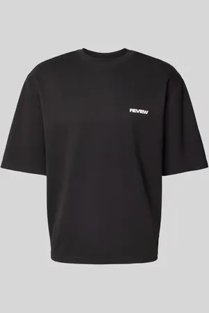 Review T-shirt o kroju oversized z nadrukiem z logo