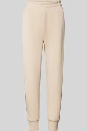 Guess Spodnie dresowe o kroju regular fit z lampasami z kamieniami stras