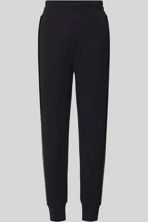 Guess Spodnie dresowe o kroju regular fit z lampasami z kamieniami stras