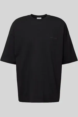 Review T-shirt o kroju oversized z nadrukiem z logo