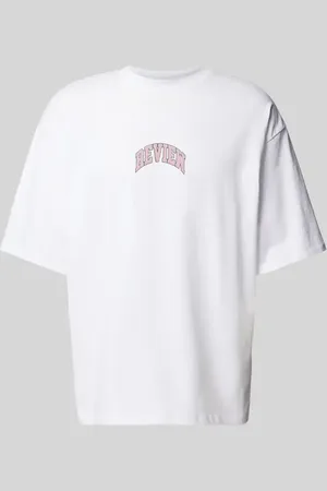 Review T-shirt o kroju oversized z nadrukiem z logo
