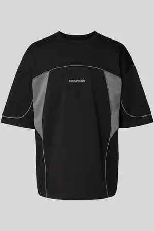 Review T-shirt o kroju oversized z nadrukiem z logo