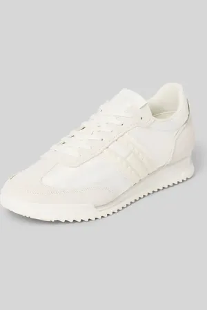 Tommy Hilfiger Sneakersy skórzane z napisem z logo model ‘RETRO RUNNER CLEATED’