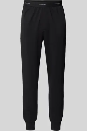Calvin Klein Spodnie dresowe o kroju regular fit z pasem z logo