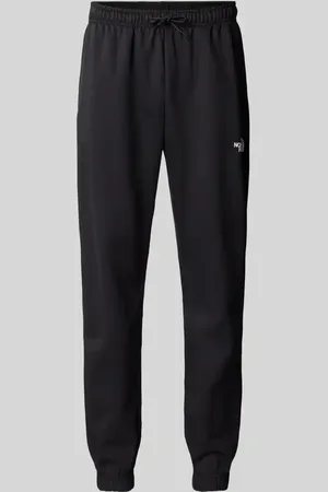 The North Face Spodnie dresowe o kroju regular tapered fit z nadrukiem z logo