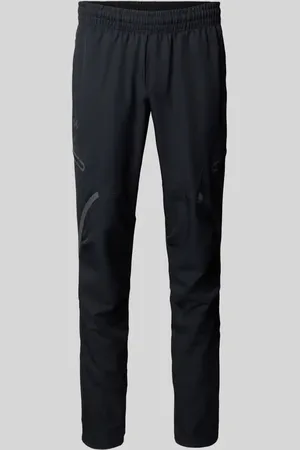 Under Armour Spodnie treningowe o kroju relaxed fit z kieszeniami cargo model ‘Unstoppable’