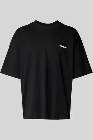 Review T-shirt o kroju oversized z nadrukiem z logo