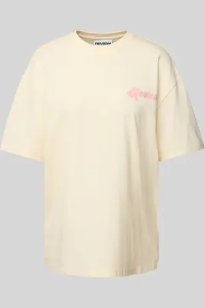Review T-shirt o kroju oversized z nadrukiem z logo
