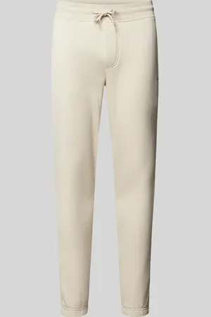 Tommy Hilfiger Spodnie dresowe o kroju slim fit z detalem z logo