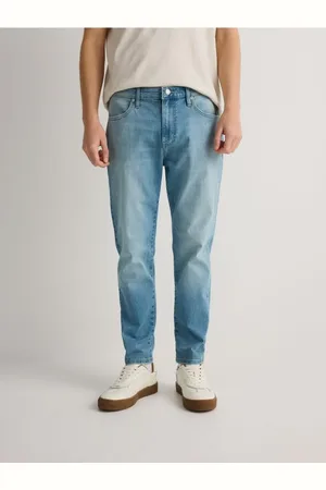 Reserved Jeansy carrot slim z efektem sprania