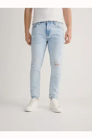 Reserved Jeansy carrot slim z przetarciami