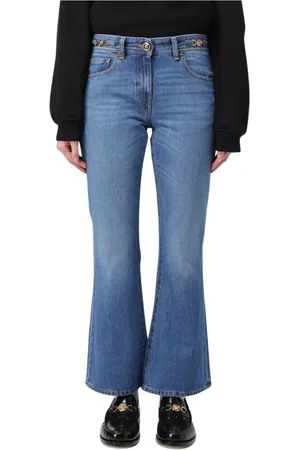 VERSACE Jeansy, Kobieta, Niebieski, W28, Denim, Eleganckie Niebieskie Dzwony z Pasem Meduzy