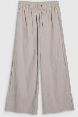 4F Damskie spodnie casual WSS25TTROF1012 - beżowe