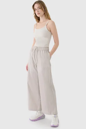 4F Damskie spodnie casual WSS25TTROF1012 - beżowe