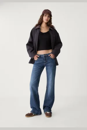 Stradivarius Jeansy low waist flare 34
